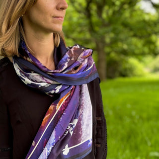 Female model in close-up with Blue Avon Serenity scarf slung over one shoulder, radiating quiet poise and softness