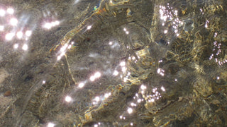 A close up of sparkling, shallow waters in the red sea in Egypt, this was th e inspiration for the first silk scarf in the Serenity collection.