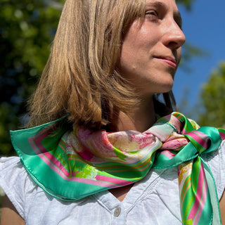 Side knot styling close-up of Appledrop silk scarf in profile view showing elegant candy-coloured pattern and playful style