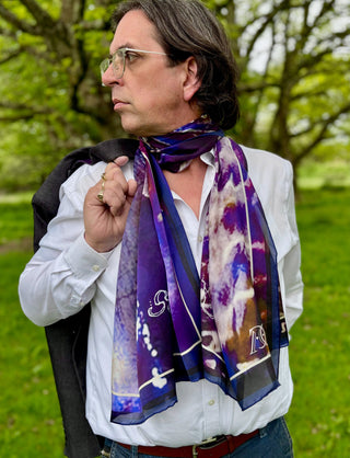 Evening styling of scarf with soft folds, reflecting subdued elegance and luminous silk drape