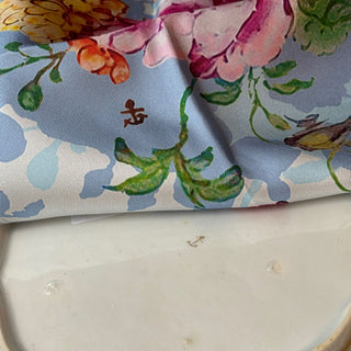 Signature detail on reverse of antique Chelsea porcelain plate and on twill scarf design, gold anchor mark evoking storied craftsmanship