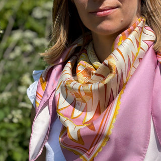 Close-up of model wearing Derby Pattern 188 scarf in front bandana style, showcasing border detail