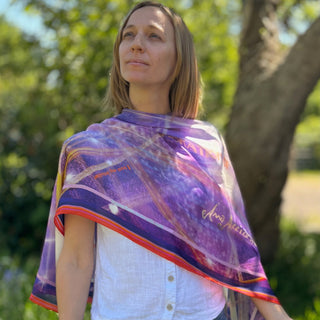 Draped silk scarf in purple with gold and white sparkles, red border, and ‘Synchronicity’ and ‘Serendipity’ in bold script
