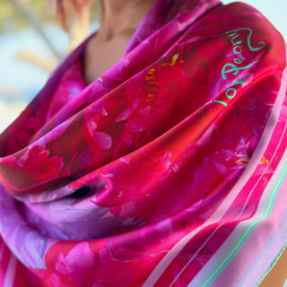 Love peony Square Silk Scarf draped as loose Bandana on model in shade