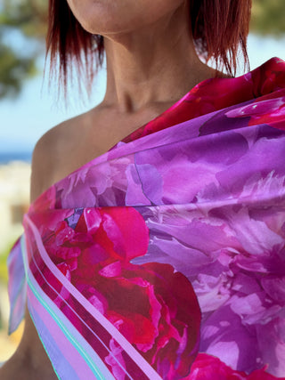 The love peony square scarf worn as a shawl Bardot style, in the shade