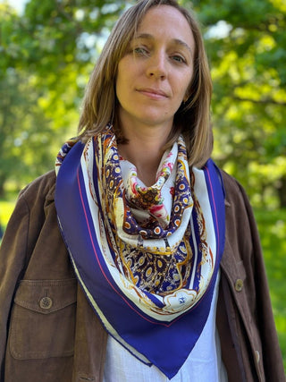 The Northumbria Silk Scarf styled as a loose bandana with a brown suede safari jacket, modern heritage meets classic design.