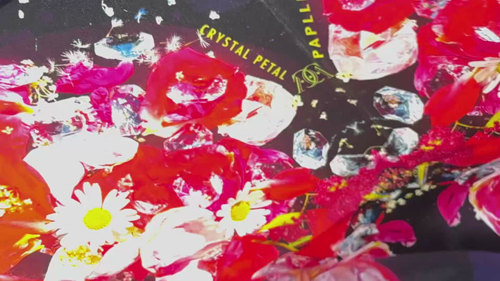 A short video of Crystal Petal Papllion Square Silk Scarf blowing in the wind.