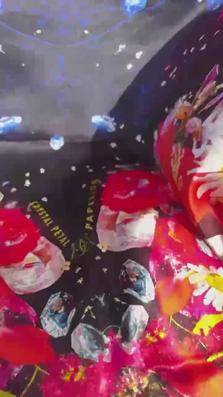 Close-up video of Crystal Petal Papillon silk scarf showing shimmering texture and silk movement