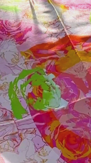 Silk detail video showing Appledrop scarf catching light, illustrating luxurious sheen and dynamic colour flow