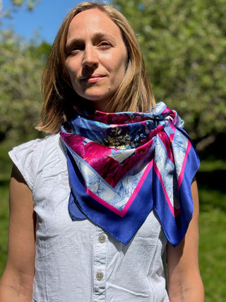 Female model wearing the Royal Peony Crush scarf in bandana style with a side knot, radiating playful elegance and regal charm.