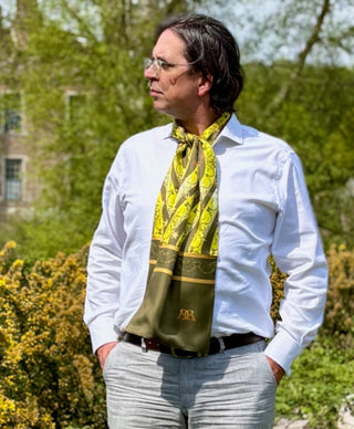Male model wearing Starry Olive Derby scarf tied around neck for formal and elegant classic fashion