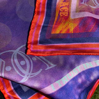 Synchronicity, the lucky silk scarf in purple with red border and hand rolled edge detail